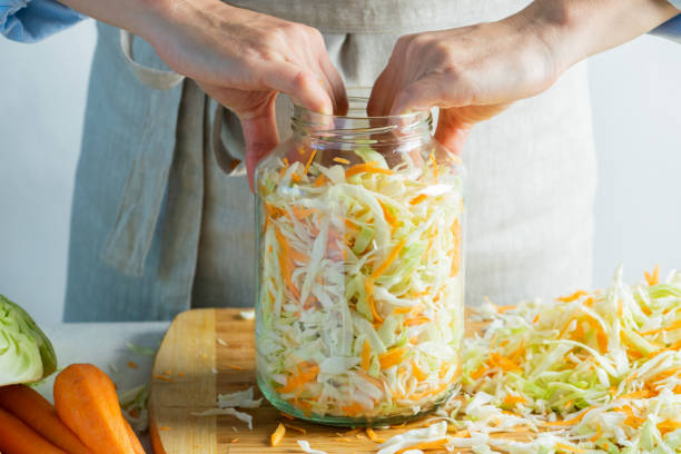 istock The preparation process fermentation preservation Sauerkraut on a light background. Natural rustic style. Canned food 1170485472