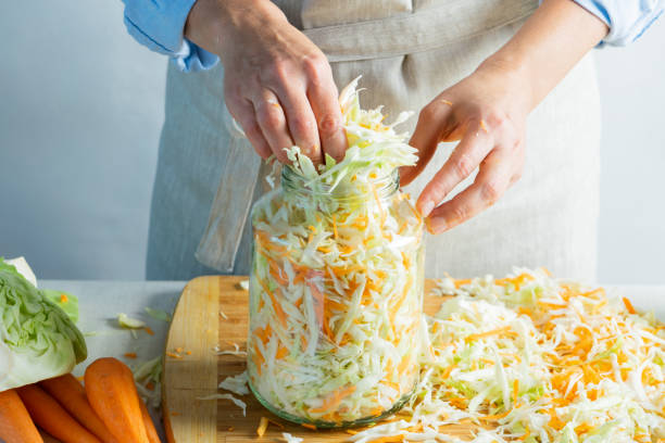 istock The preparation process fermentation preservation Sauerkraut on a light background. Natural rustic style. Canned food 1170485486