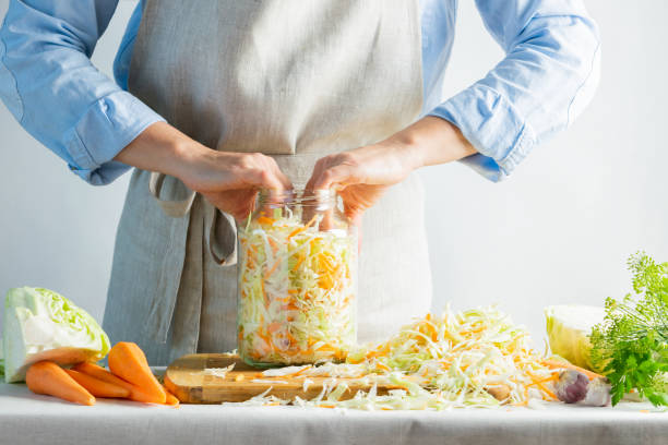 istock The preparation process fermentation preservation Sauerkraut on a light background. Natural rustic style. Canned food 1170485488