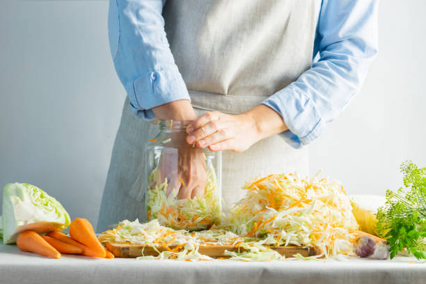istock The preparation process fermentation preservation Sauerkraut on a light background. Natural rustic style. Canned food 1170485497