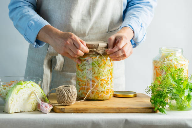 istock The preparation process fermentation preservation Sauerkraut on a light background. Natural rustic style. Canned food 1170485528