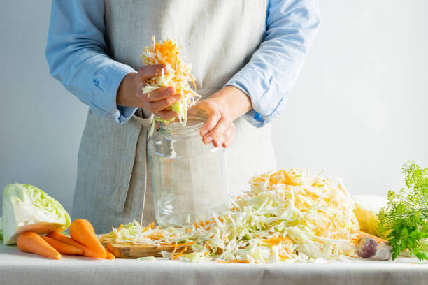 istock The preparation process fermentation preservation Sauerkraut on a light background. Natural rustic style. Canned food 1170485530