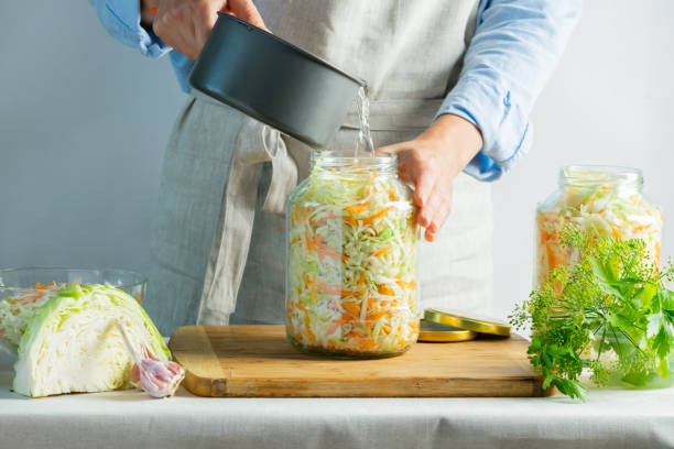 istock The preparation process fermentation preservation Sauerkraut on a light background. Natural rustic style. Canned food 1170485550