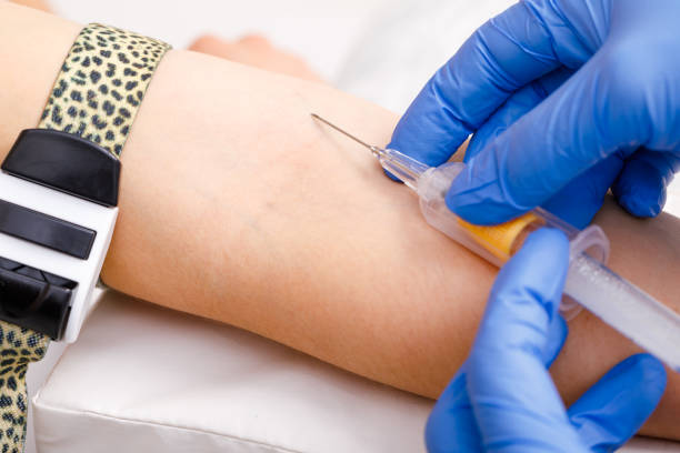 istock Nurse takes a blood sample from arm vein performing a venipuncture 1170486757