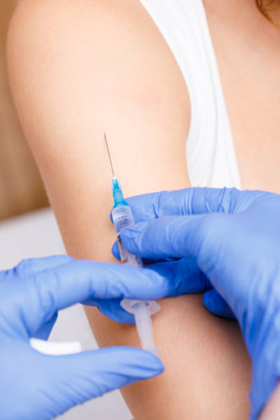 istock Doctor injecting a vaccine in arm close-up 1170486810