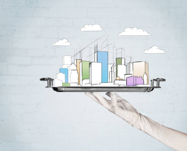 istock Hand serving city and clouds on tray 1170487217