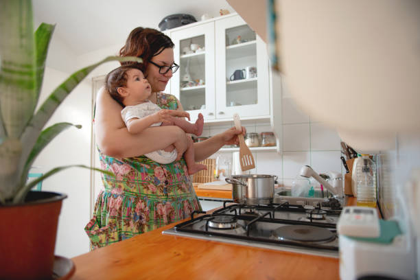 istock Mother cooking lunch for her baby 1170488448