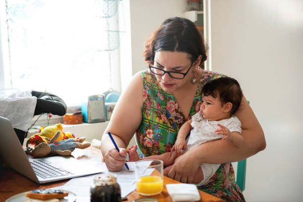 istock Working mom with baby in a lap 1170488631