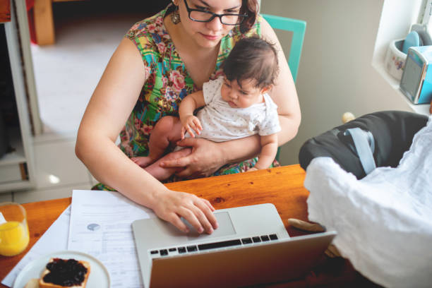 istock Working mom with baby in a lap 1170488670