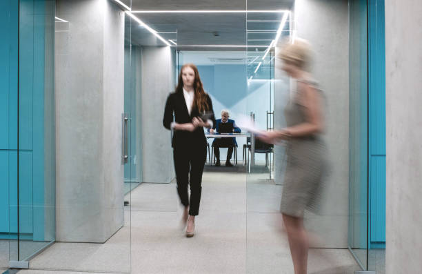 istock Business People Walking Down The Hallway 1170490562