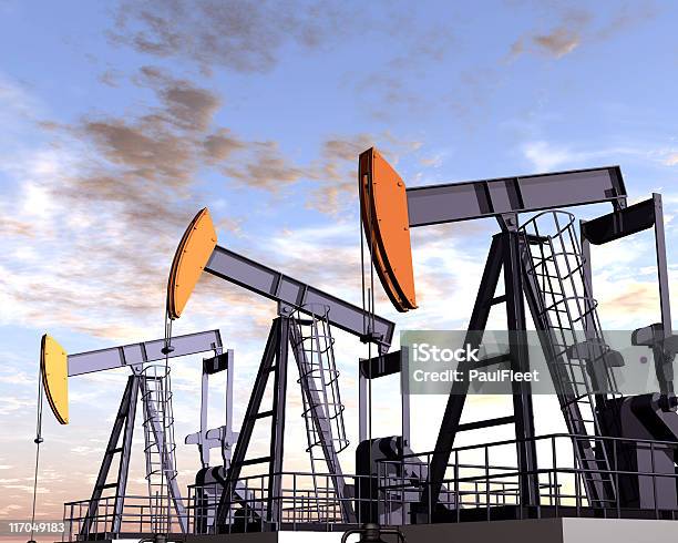 Oil Field Against Sunset In Desert Stock Photo - Download Image Now - Color Image, Construction Industry, Construction Machinery