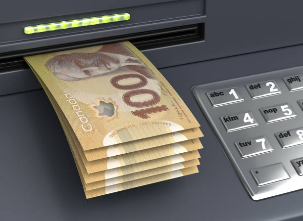 Withdrawal Canadian Dollar From The ATM Withdrawal Canadian Dollar From The ATM Mechine canadian currency photos stock pictures, royalty-free photos & images