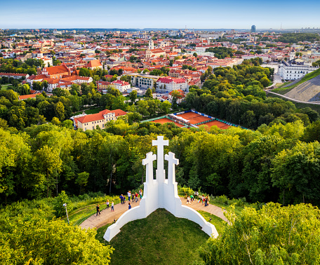 Aerial view of the Three Crosses monument overlooking Vilnius Old Town on sunset. Vilnius landscape from the Hill of Three Crosses, Lithuania