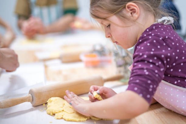 istock Girl preparing cookies 1170492432
