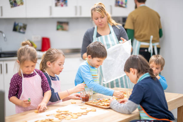 istock Children decorating cookies 1170492450
