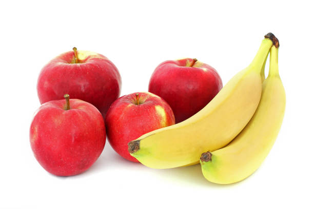 istock Bananas and apples on a white background 1170493741