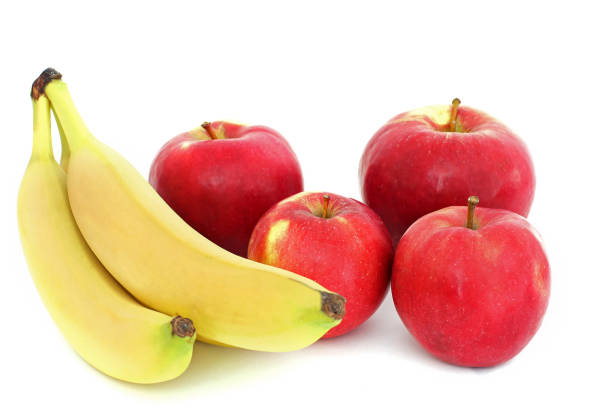 istock Bananas and apples on a white background 1170493750