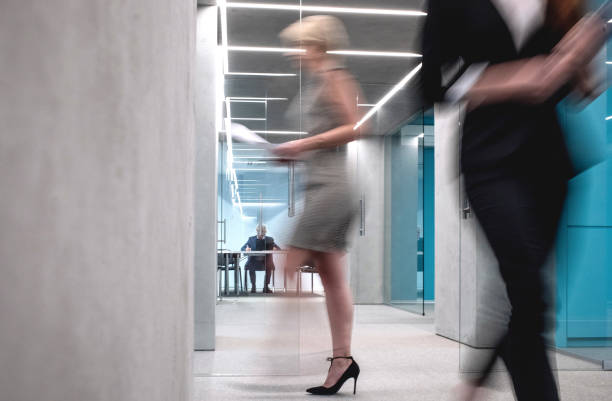 istock Business People Walking Down The Hallway 1170493773