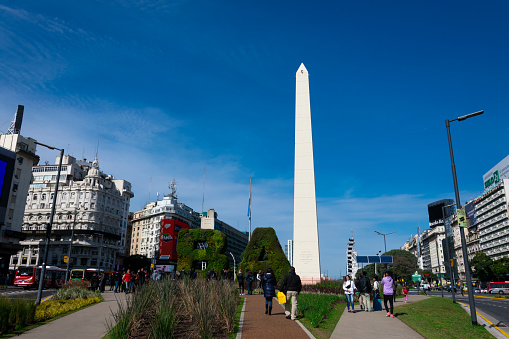Buenos Aires, Argentina. August 19, 2019. Vertical garden, BA characters at Republic Square (Plaza de la Republica) and Obelisk of Buenos Aires (El Obelisco) in the background