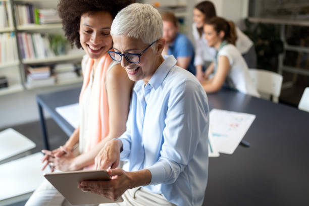 istock Team of colleagues brainstorming together while working in modern office 1170494301