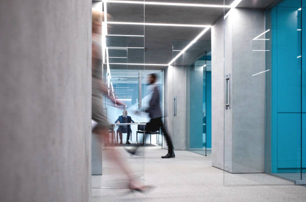istock Business People Walking Down The Hallway 1170494438