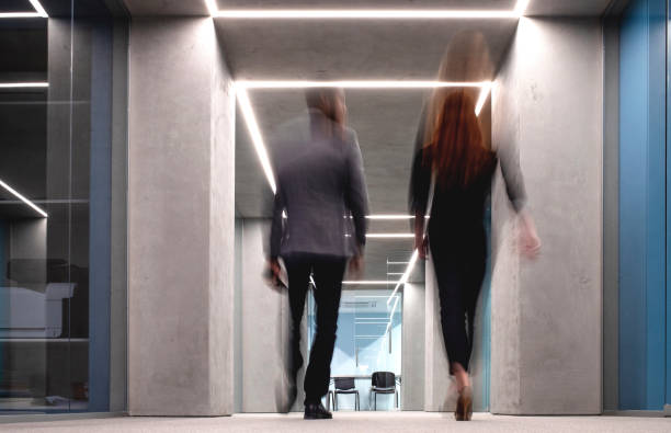 istock Business People Walking Down The Hallway 1170495002