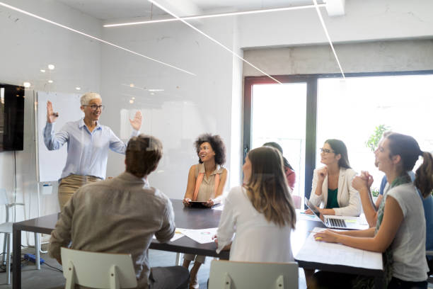 istock Team of colleagues brainstorming together while working in modern office 1170495662