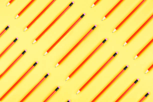 istock Erasable red colored pencils diagonal flat lay on yellow background 1170496029