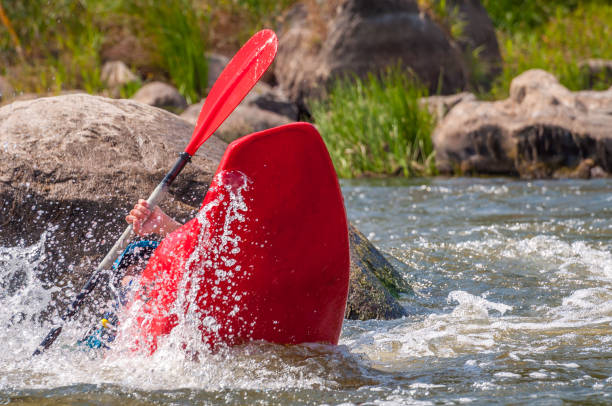 istock Playboating. Kayaking freestyle on whitewater. Eskimo roll. 1170497373