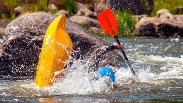 istock Playboating. Kayaking freestyle on whitewater. Eskimo roll. 1170497395