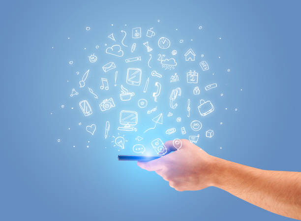 istock Hand with phone and drawn office icons 1170497696