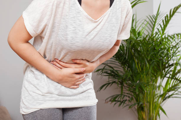istock young woman have stomach ache 1170499235