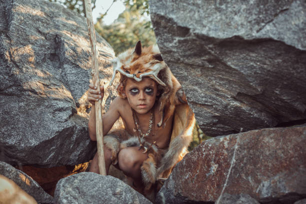 istock Caveman, manly boy hunting outdoors. Ancient warrior portrait 1170499331