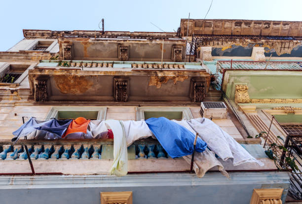 Havana Apartment Building\nBalcony with washed clothes drying in the air