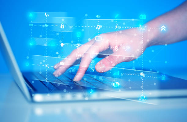 istock Hand pressing keyboard with high tech media icons 1170500747