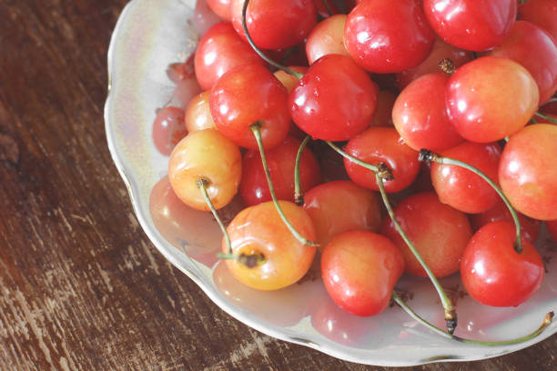 istock Cherries. Cherry on a wooden table 1170501775
