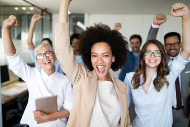 istock Group of successful business people in office 1170503564