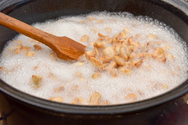 istock Preparing delicious unhealthy fried pork cracklings 1170504350