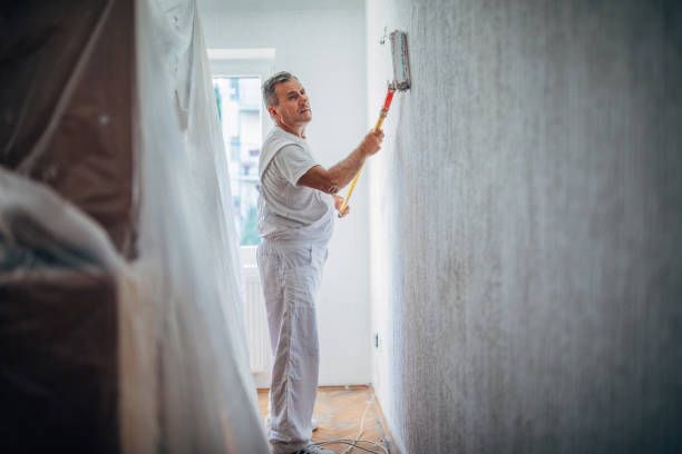 One man painting the walls