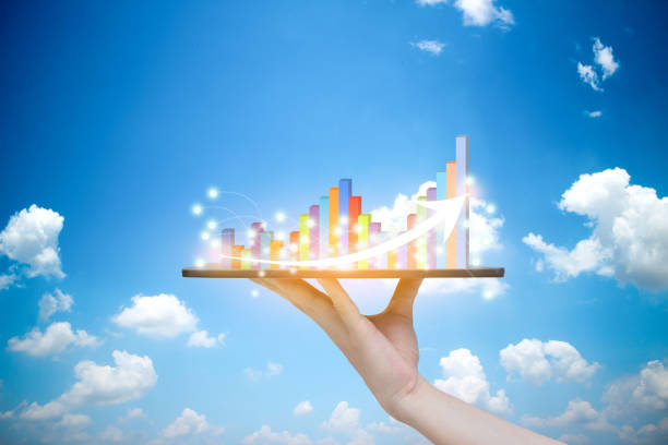 istock Tablet on hand growth progress graph analysis or success business concept Sky background 1170504604