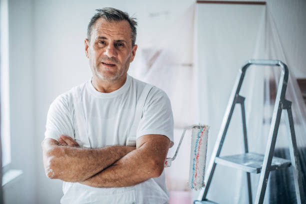 portrait of happy painter - house painter home improvement professional occupation occupation imagens e fotografias de stock