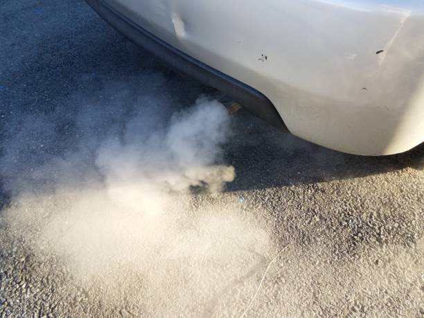 istock car exhaust or smoke and black asphalt 1170505023