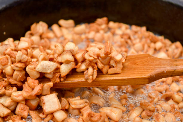 Preparing delicious unhealthy fried pork cracklings