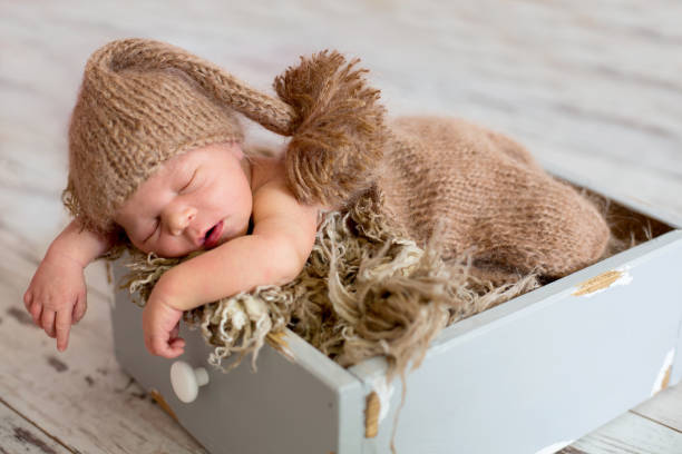 istock Newborn baby boy, sleeping happily 1170507096