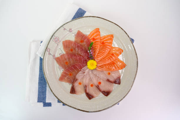 istock Sliced raw Salmon, Hamachi, Maguro sashimi set on ceramic dish 1170507152
