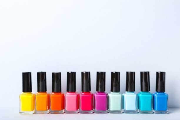 istock Nail polish bottles on gray background 1170507394