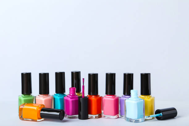 istock Nail polish bottles on gray background 1170507446