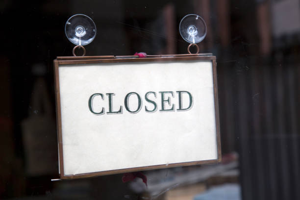 istock Closed Sign on Shop Door 1170507731