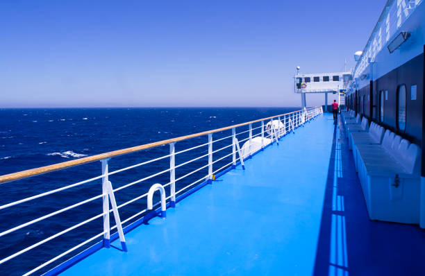 istock Man walking alone on ship ferry deck , during sail in Aegean sea, Greece. 1170509188