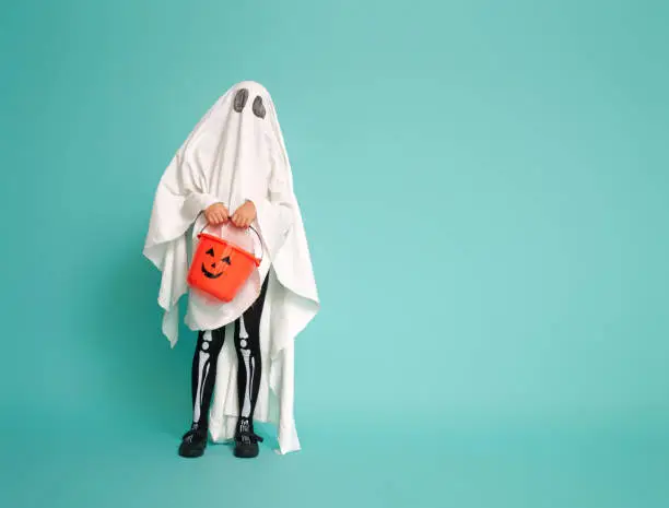 Photo of kid in ghost costume
